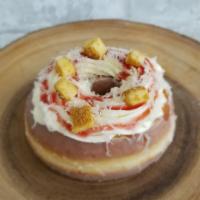 Manchego cheesecake · Our cheesecake doughnut mkafde with real cheesecake pieces, strawberry sauce and Manchego ch...