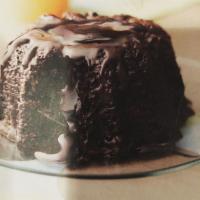 Molten Chocolate Cake · Our moist dark chocolate cake enrobed with dark chocolate....filled with dark chocolate truf...