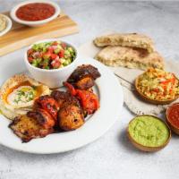 Vegetable Skewer Plate (V, GF) by Oren's Hummus · By Oren's Hummus. Grilled onion, tomatoes, red bell pepper, eggplant and mushrooms. Served w...