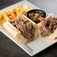 Italian Beef Sandwich · A sandwich composed of thin slices of seasoned roast beef, simmered and  served au jus on a ...