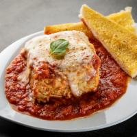 Lasagna · Homemade from the family recipe. Layers of ribbon noodles and three cheeses, smothered in ma...