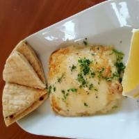 Cheese Saganaki · Greek Kefalograviera cheese, seared in extra virgin olive oil, topped off with fresh lemon j...