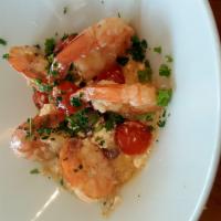 Shrimp Saganaki · Sautéed shrimp with garlic, cherry tomatoes, Kalamata olives, feta cheese and served with ho...