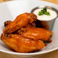Buffalo Wings · Wings tossed with Buffalo sauce and served with Blue dressing