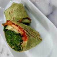Veggie Quinoa Wrap · Served with spinach wrap, hummus, mixed greens, tomatoes, peppers, cucumbers and balsamic gl...