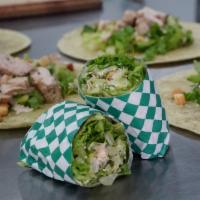 Chicken Caesar Wrap · Served with spinach herb white wrap, romaine lettuce, croutons and Caesar dressing.
