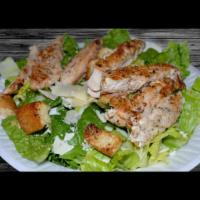 Chicken Caesar Salad · Our Caesar salad topped with fresh grilled chicken. Served with pita bread.