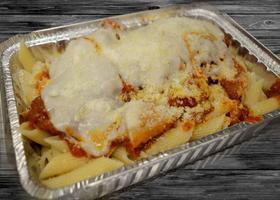 Chicken Parmigiana · Chicken breast covered in melted provolone with your choice of ziti or angel hair pasta with...