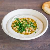 Classic Hummus · Fresh hummus dish served with cooked chickpeas, topped with olive oil fresh parsley and our ...