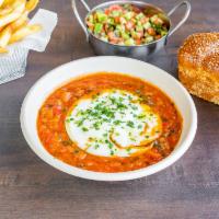 Shakshuka Plate · 2 poached eggs in a garlicky tomato stew. Comes with fresh pita, side chopped salad and frie...