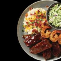 Ribs & Shrimp · A mouth-watering combination plate of our special BBQ sauce paired with shrimp.
Served with...
