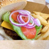 Cajita Dos Mares/Hamburger with fries · Hamburger with french fires in a box with lettuce ,tomato and cheese.