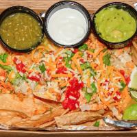 Nachos · Fresh fried tortilla chips with your choice of meat. Topped with queso, onions, cilantro, to...