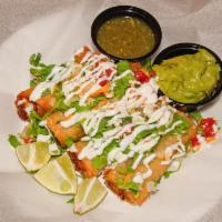 2  Piece Chicken Flautas · Fried flour tortilla, with chicken, black bean, and corn. Topped with lettuce, onion, tomato...