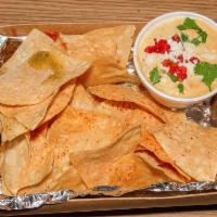 Chips and Queso · Daily fresh-made queso dip. Substitute grain free chips for an additional charge.
