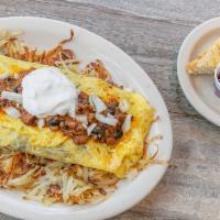 Homemade Chili ＆ Cheese Omelette* · Scratch made chili, topped with onions, cheese and sour cream.
