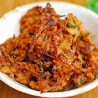 Onion Bhaji · Thin-sliced onions and chickpea batter fried.