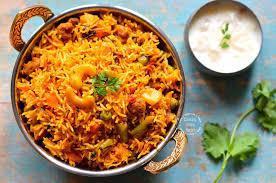 Sindhi Chicken Tikka Biryani · Oven-baked chicken tikka, basmati rice, and Bombay style biryani masala.
