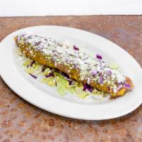 Tlacoyo Santa Fe · Fill with cheese and meat of your choice. Garnished with refried beans, green sauce, queso f...