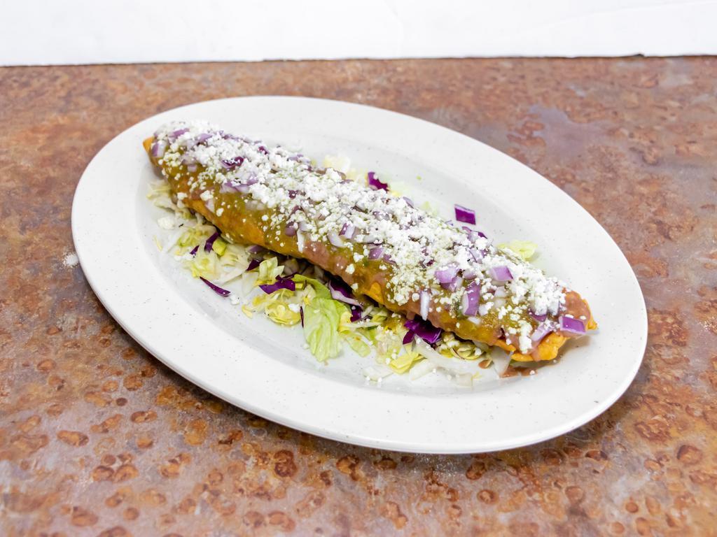 Tlacoyo Santa Fe · Fill with cheese and meat of your choice. Garnished with refried beans, green sauce, queso fresco and diced onions.