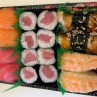 Sushi Combo · Assortment of shrimp, eel, salmon, and tuna nigiri.
