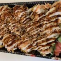 Ohio Roll · Cream cheese, crab stick, crab salad top, spicy mayonnaise, sushi sauce, avocado, and sesame...