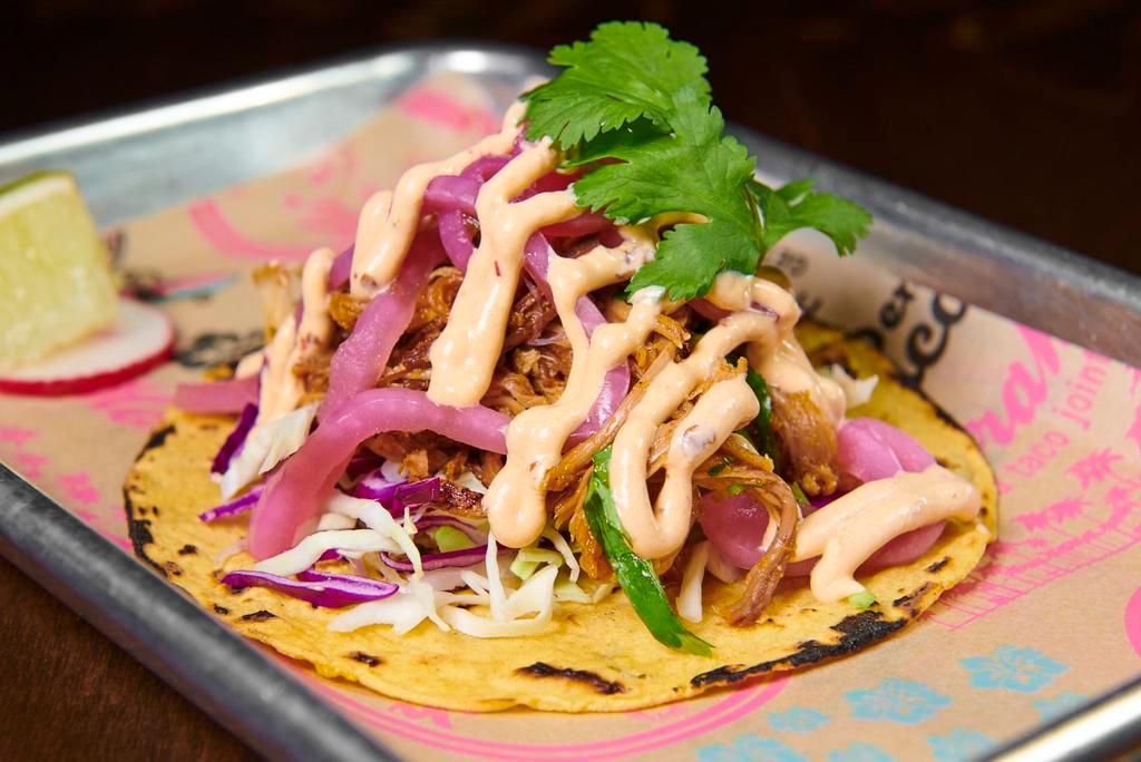 Sunset Pork Taco · Chipotle orange pineapple pork, Cali coleslaw, pickled red onion and chipotle crema. Served with homemade corn tortilla. Gluten free.