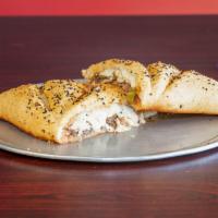 Calzone · Made with our famous freshly made dough 12” with a special seasoning and stuffed with mozzar...