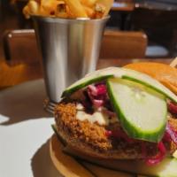 Falafel Burger · Pickled beets, tomato, cucumber, tahini dressing and brioche.