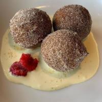 Lemon Ricotta Donuts · Lemon and ricotta donuts served with a thyme and vanilla custard sauce.