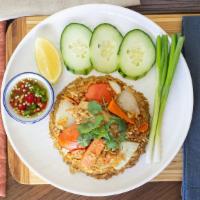 Khao Pad / Fried Rice / ข้าวผัด · Rice, carrot, onion, tomato and choice of chicken or pork served with scallion, cucumber, li...