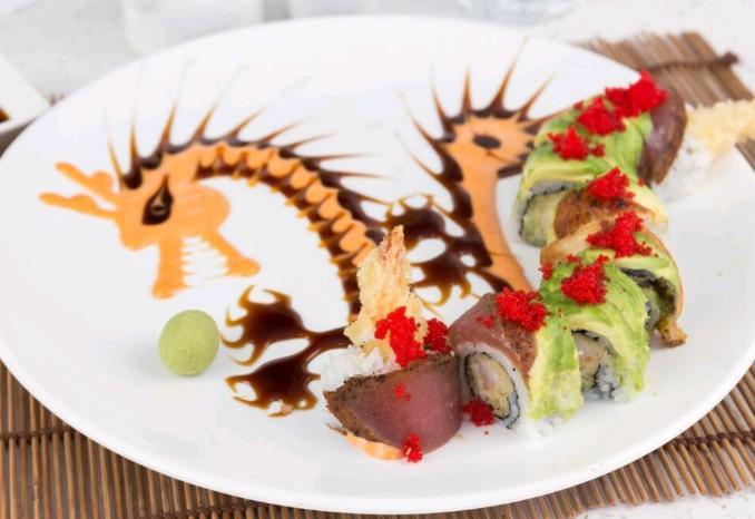 Flaming Dragon Roll · Shrimp tempura with cucumber on the inside, wrapped with pepper seared tuna, eel and avocado on the outside with eel sauce and spicy mayo