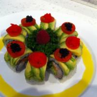 Paradise Roll · White tuna, salmon, yellowtail and jalapeno inside, topped with avocado, cherry tomato, red ...