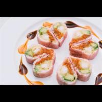 Lover's Roll · Shrimp tempura, spicy tuna and avocado in pink soy paper, served with spicy mayonnaise and e...