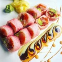 Pretty in Pink Roll · 10 pieces. Tuna, salmon, yellowtail and avocado wrapped with pink soy paper. Served with swe...