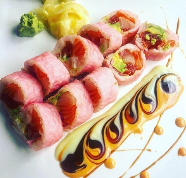 Pretty in Pink Roll · 10 pieces. Tuna, salmon, yellowtail and avocado wrapped with pink soy paper. Served with sweet wasabi mayonnaise, spicy mayonnaise and eel sauce.