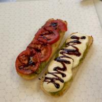Caprese Sandwich · House made Pesto and fresh Buffalo Mozzarella Toasted on a Hoagie Roll with sliced Tomatoes,...