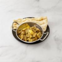 Curry Goat Roti Meal · Comes with curry potatoes.