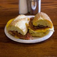 Hungry Man Sandwich · 3 eggs any style, bacon, sausage, ham, and American cheese on a hero.