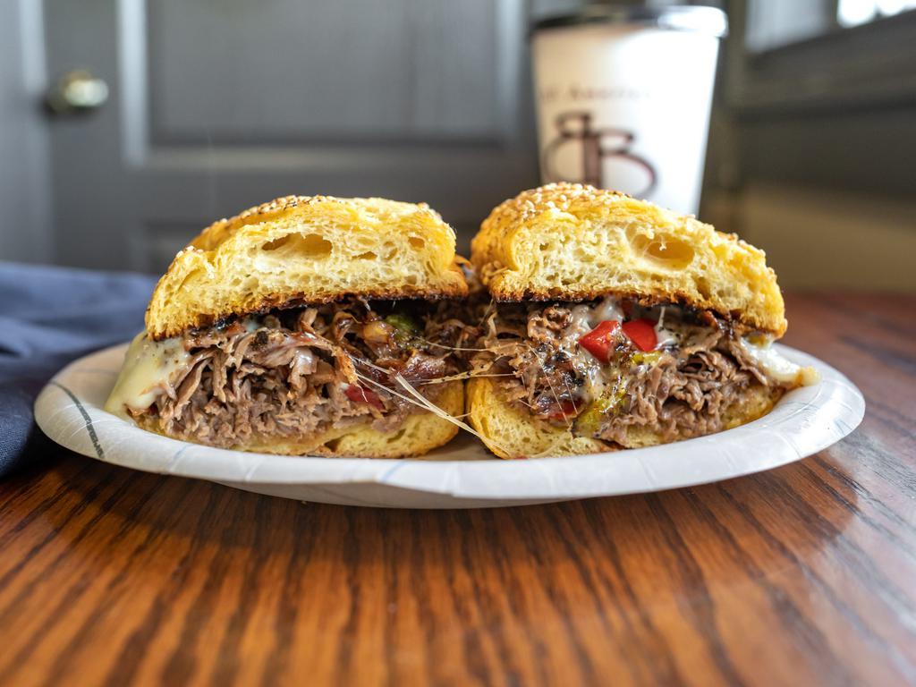 Philly Cheese Sandwich · Thin sliced roast beef, smothered with mozzarella cheese, grilled onions and peppers on a bagel or hero.