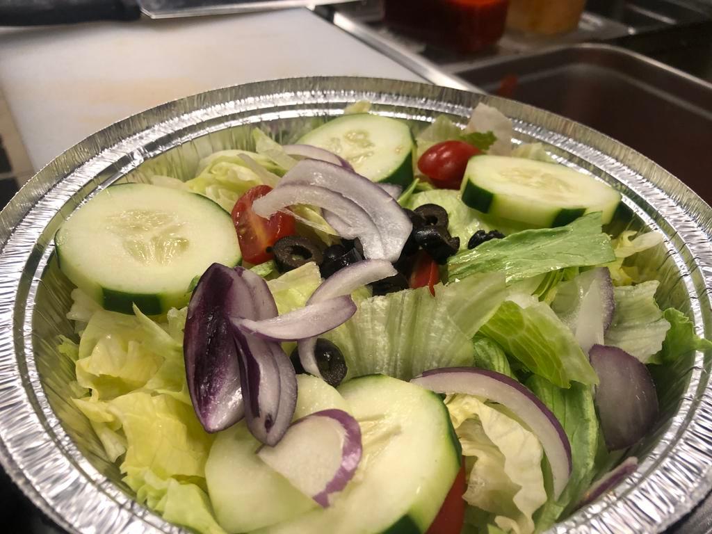 Italian House Salad · Iceberg lettuce, cucumber, black olives, tomato, red onion, fresh mozzarella with our house made red wine dressing.