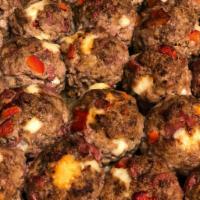 Stuffed Meatball · Mozzarella, salami, provolone, roasted peppers, capicola garnished with capers and olives in...