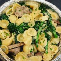Orecchiette Broccoli Rabe and Sausage · Small pastsa that is shaped like an ear.