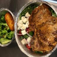 Veal Milanese · Veal cutlet breaded, pan fried, topped with tomato, onion and arugula salad (comes with sala...
