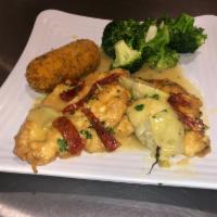 Chicken Francese · Served in a white wine and lemon butter sauce.