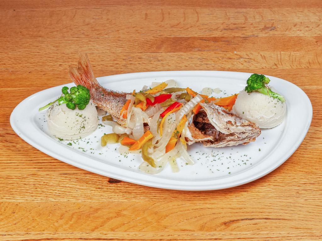Escovitch Whiting Fish · fried whiting fillet topped with escovitch onions, peppers, and carrots.