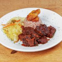 Flava's Oxtail · Everyone's favorite and most popular dish. Braised oxtails stewed in Jamaican herbs, spices,...