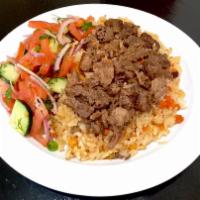 PALOV WITH BEEF · Gluten-free, diary-free Uzbek national dish with rice, meat, carrot, onion, chickpeas. Serve...