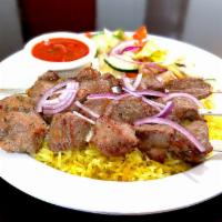 LAMB SHASHLIK · marinaded and fire-cooked cubes of lamb served with steamed rice, fresh salad and tomato sauce