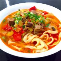 Lagman with Noodles · Soup with noodles, beef, vegetables and fresh herbs. Spicy sauce on the side.